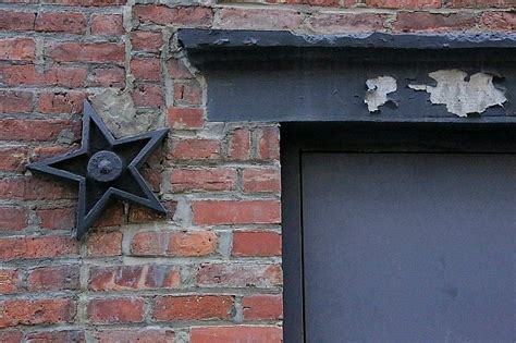 origin of metal stars on houses|old house metal star meaning.